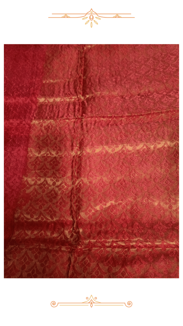Close-up of white Banarasi silk saree fabric.