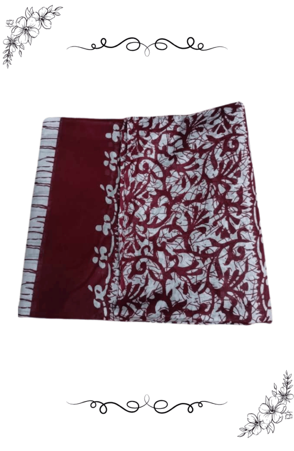Close-up design view of red and white cotton saree