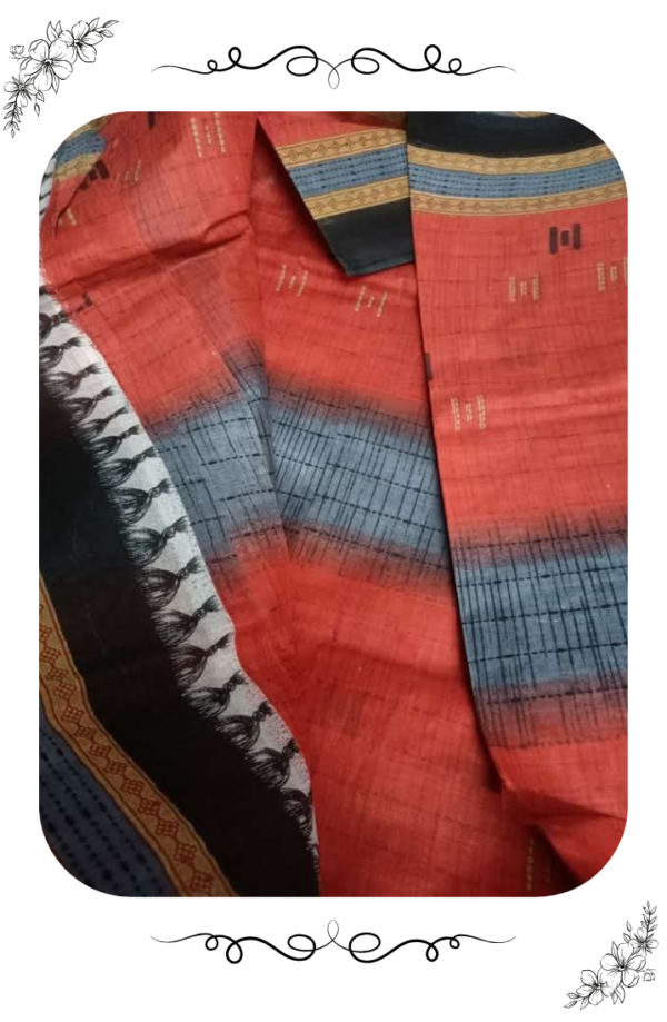Close-up image of the black designer border on red saree